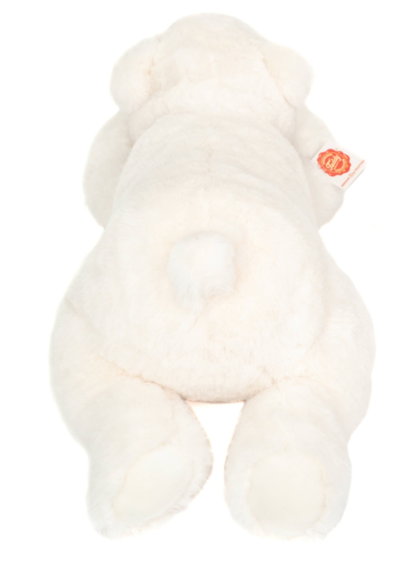 Polar bear plush lying down