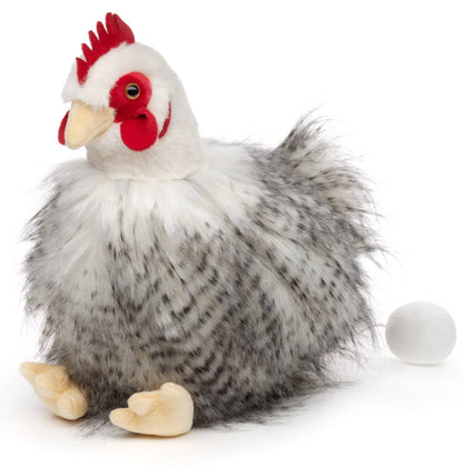 Stofftier Huhn sitzend mit Ei