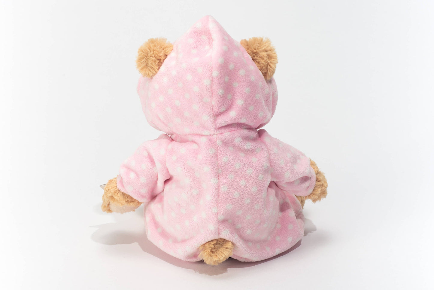 Plüschteddybär im rosa Pyjama
