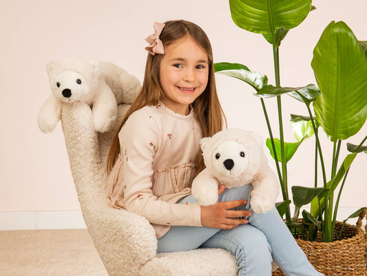 Polar bear plush lying down